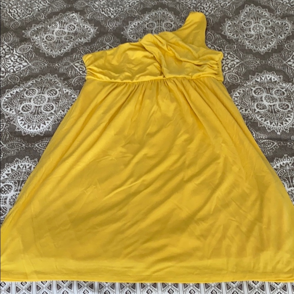 Yellow one shoulder dress.
